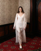 Motion shot of the floor-length lace attire, emphasizing breathability and the natural flow of the fabric.