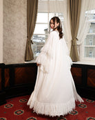 Back view of the floor-length ensemble, showcasing the ethereal finish and the natural flow of the cotton fabric.