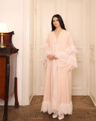 Side view of the complete set, showcasing how the gathered waist and lace edging move beautifully with the body.