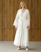 White maternity robe and gown in motion, showing the airy, flowing silhouette of the lightweight natural fabric.