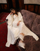 A creative shot of the luxurious lounge set, highlighting the soft drama and plush texture of the pearl velvet.