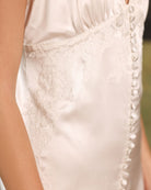 Close-up of handcrafted silk buttons on the nightgown, adding couture-level charm and refined detail to the piece.