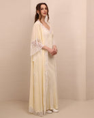 Side perspective of the ensemble, illustrating the elegant drape and the sophisticated allure of the lace-edged robe.