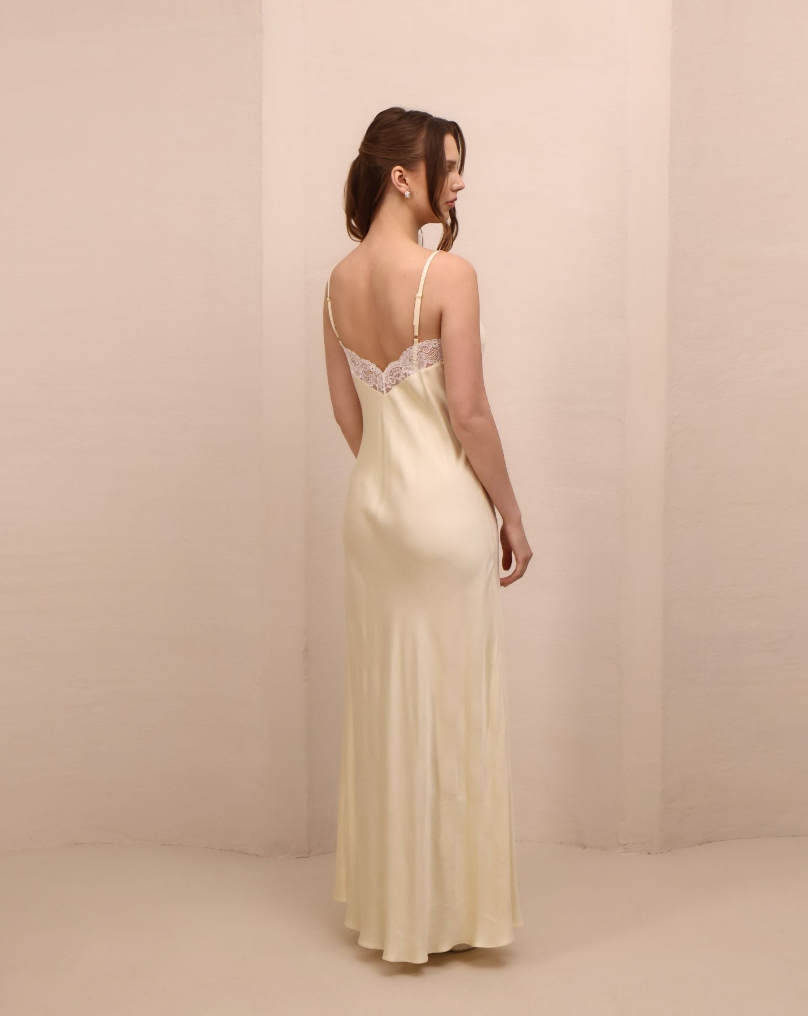 Rear view of the nightgown, highlighting the mid-open V-cut back and the soft, flattering fit that skims the body.