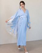 A dynamic shot of the Maternity Kaftan in motion, capturing the airy feel and elegant movement of the natural fabric.