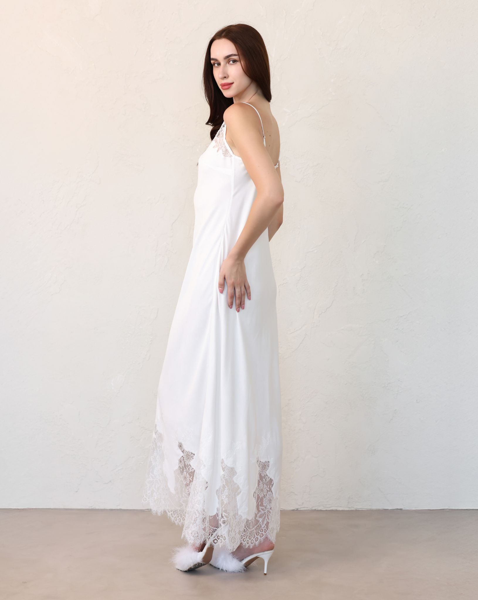 Side view of cotton dress with train and lace accents