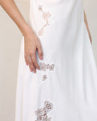 Close-up of embroidered lace detail on bridal nightgown