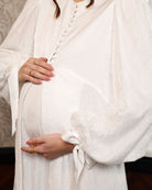 Close-up of the voluminous lace sleeves, showcasing the intricate patterns and the romantic, heirloom feel.