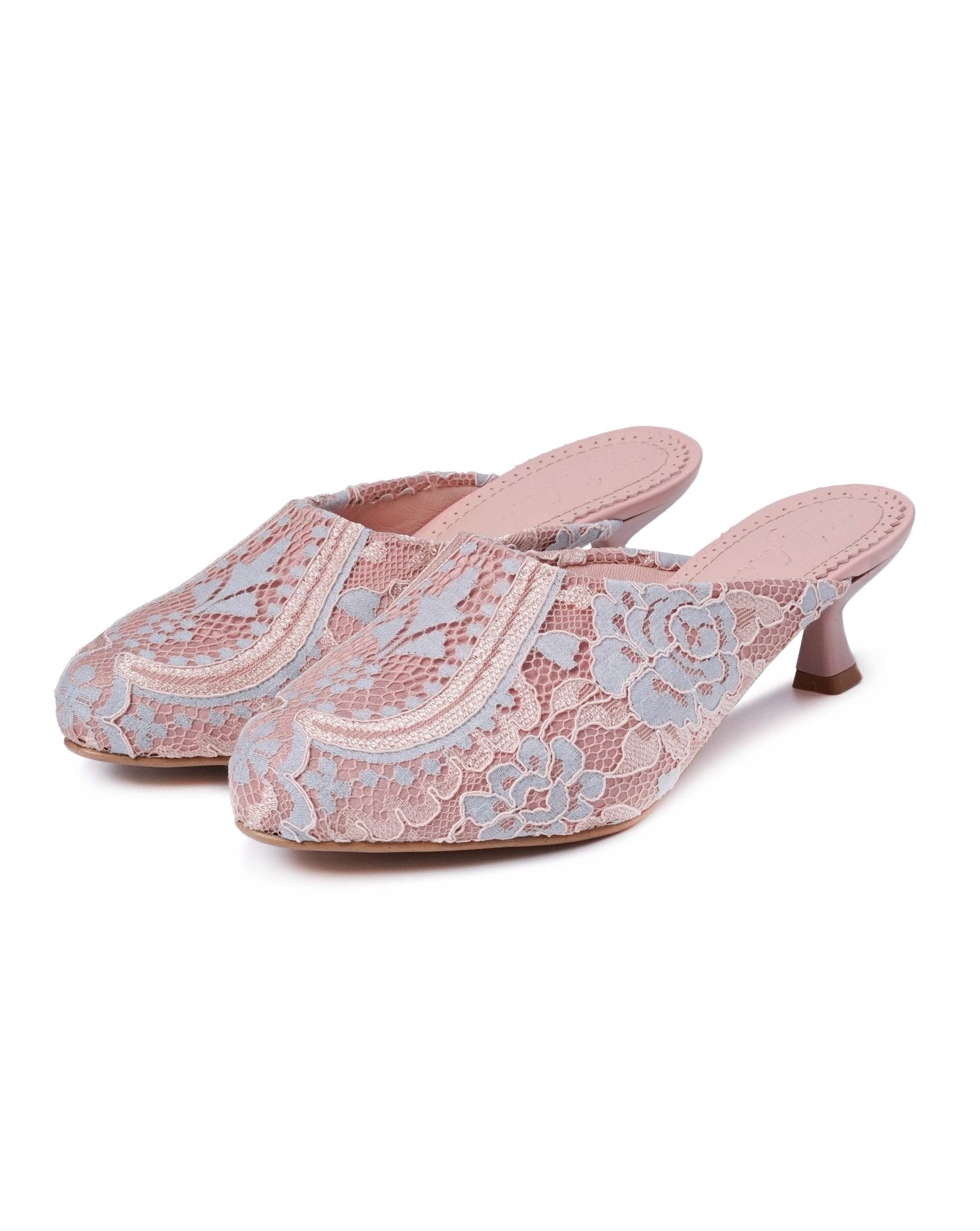 A clear shot of the pair of heeled shoes standing close together on a clean white background.