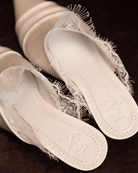 A clear view of the genuine leather insole featuring the brand logo and soft padding for long-wearing comfort.