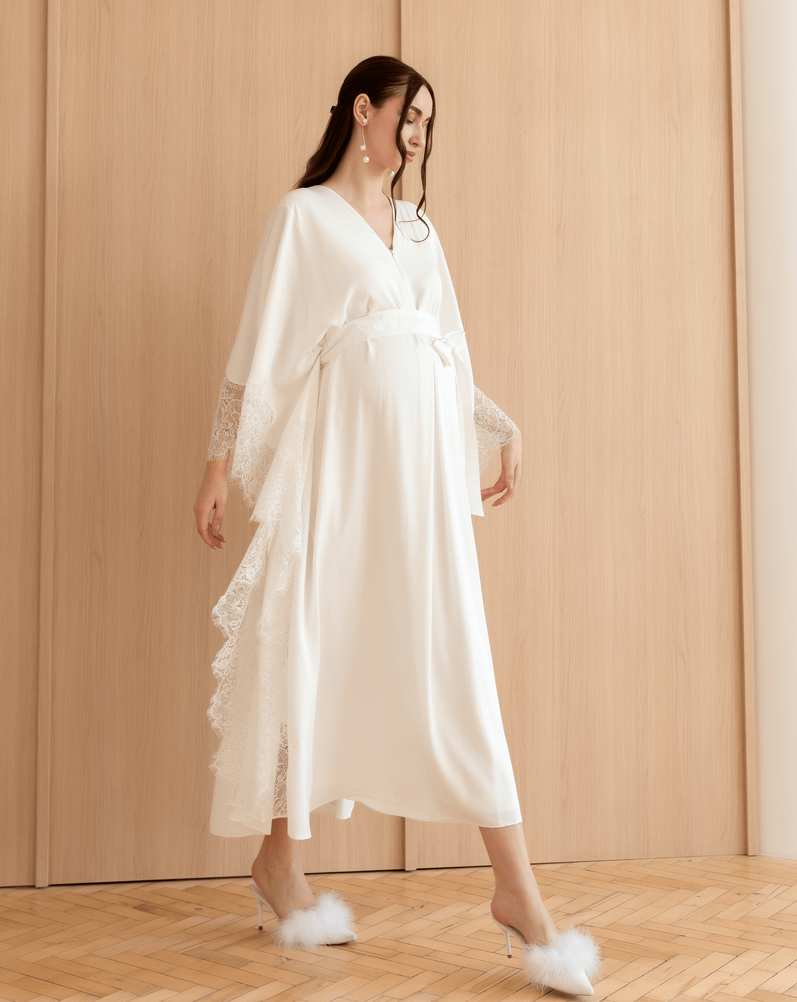 A dynamic walking shot of the Cotton Kaftan, capturing the effortless elegance and movement of the natural material.