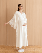 Full-length pose with hands on the belly and raised, illustrating the perfect balance of function and classic style.