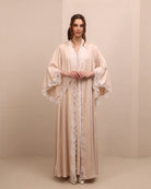 A poised frontal view of the ensemble, designed to offer comfort and serene beauty for expectant mothers.