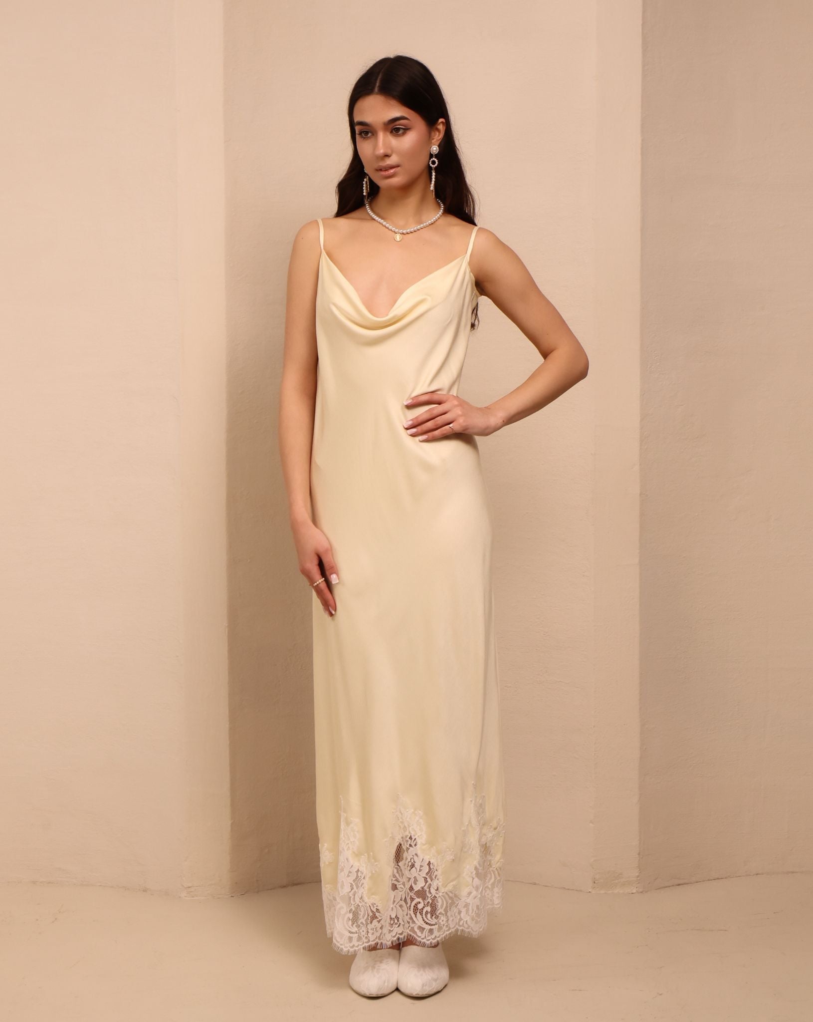 Frontal perspective of the vanilla nightgown, designed to caress the skin with its smooth and light material.