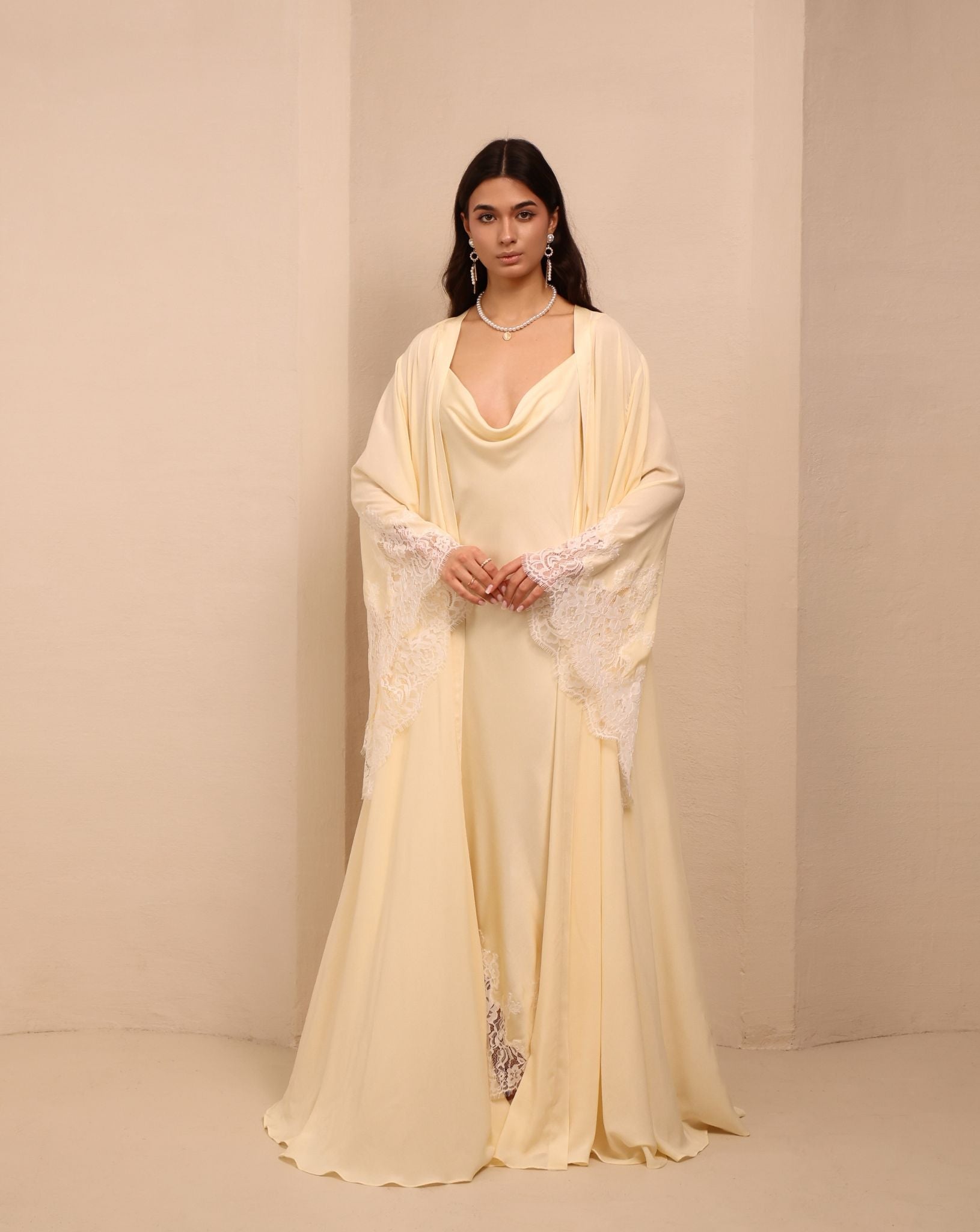Frontal view of the vanilla ensemble, showcasing the luxurious softness and poetic movement of the fabric.