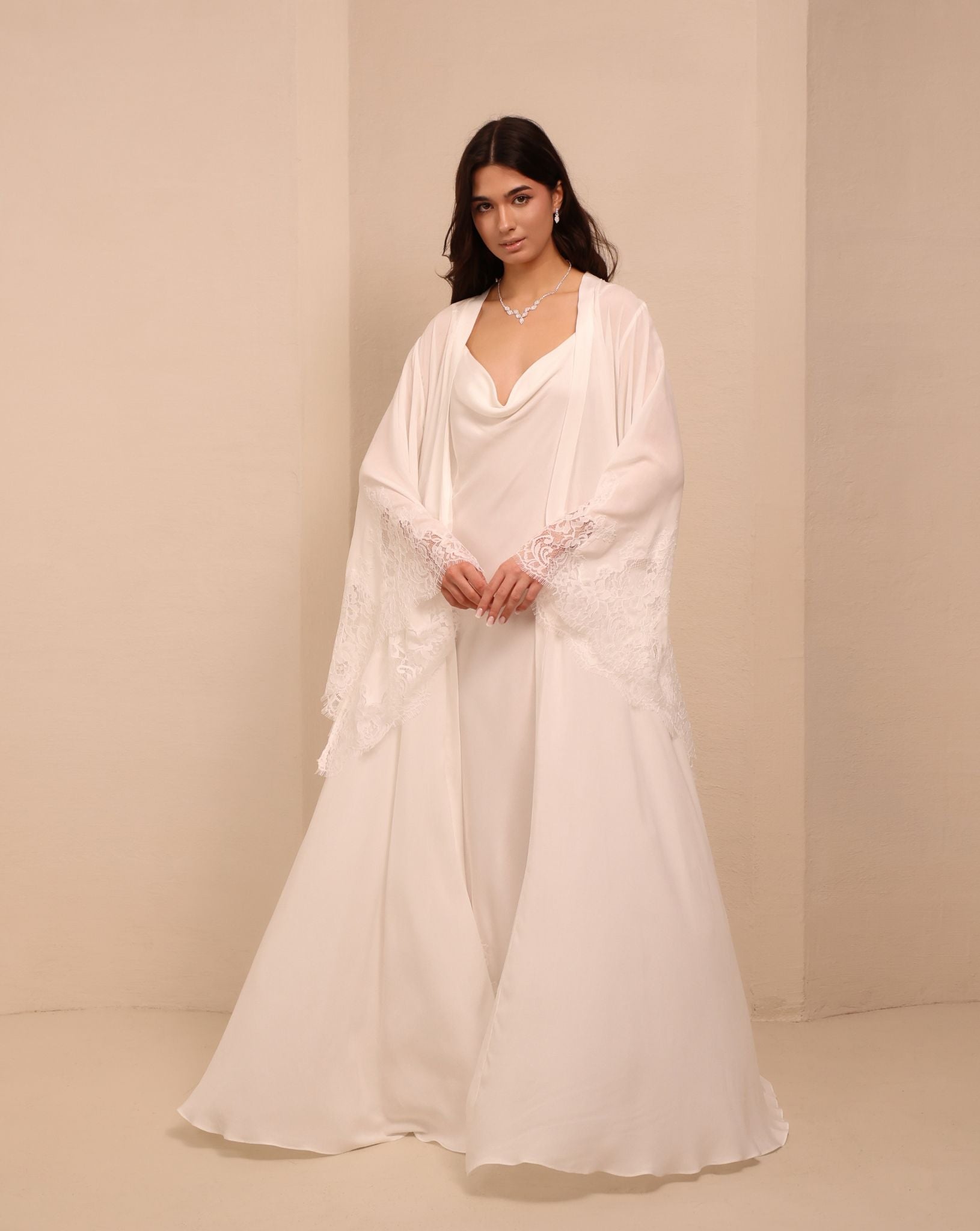 A full-length view of the white Robe and Nightgown Set, capturing its luminous and ethereal silhouette.