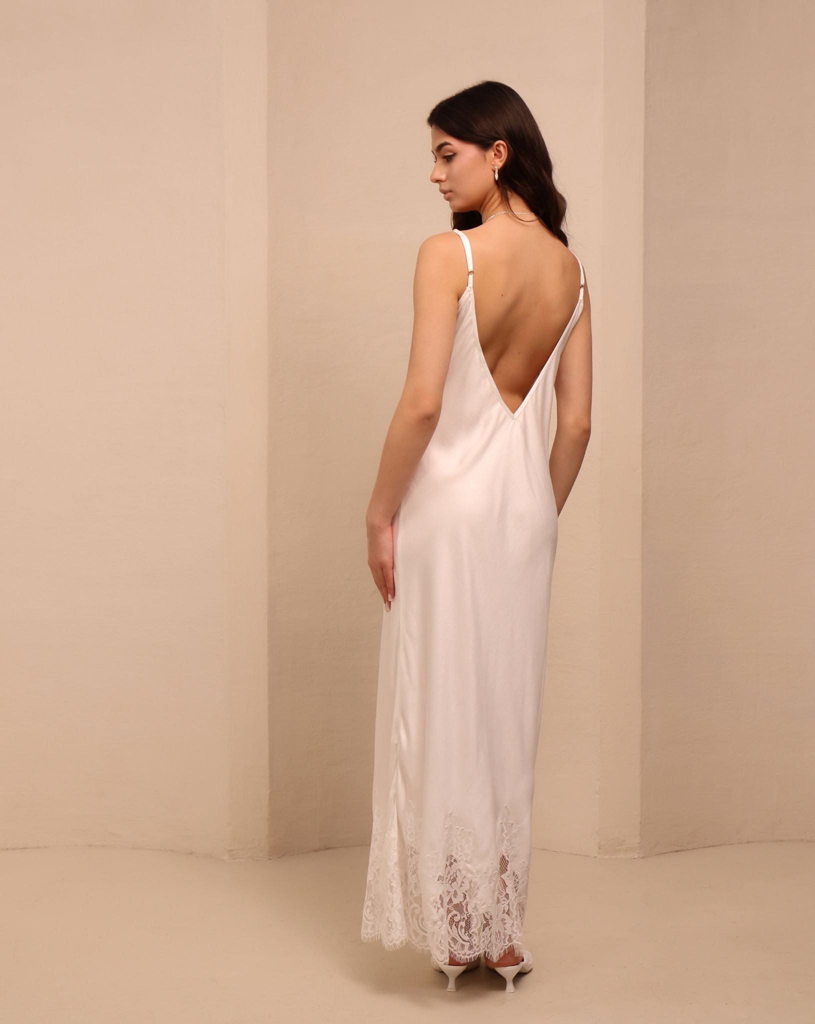 Side shot of the nightdress, showcasing the elegant drape and the beautiful V-cut detail on the back.