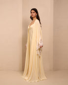 Side perspective of the layered ensemble, highlighting the effortless drape and poetic detail of the robe.