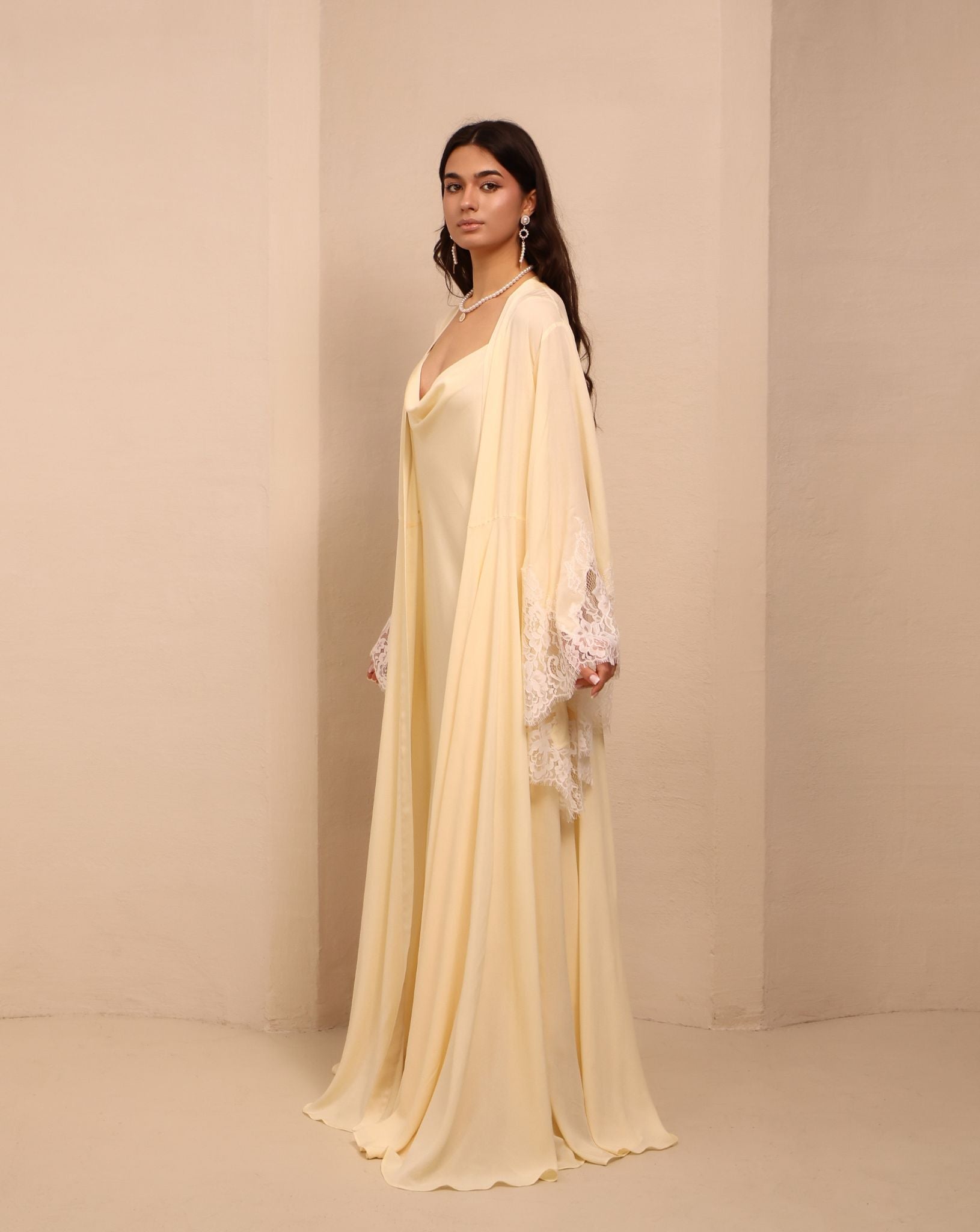 Side perspective of the layered ensemble, highlighting the effortless drape and poetic detail of the robe.