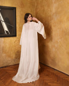 Rear view of the sheer silk chiffon robe, emphasizing the beautiful long train and weightless, airy movement.