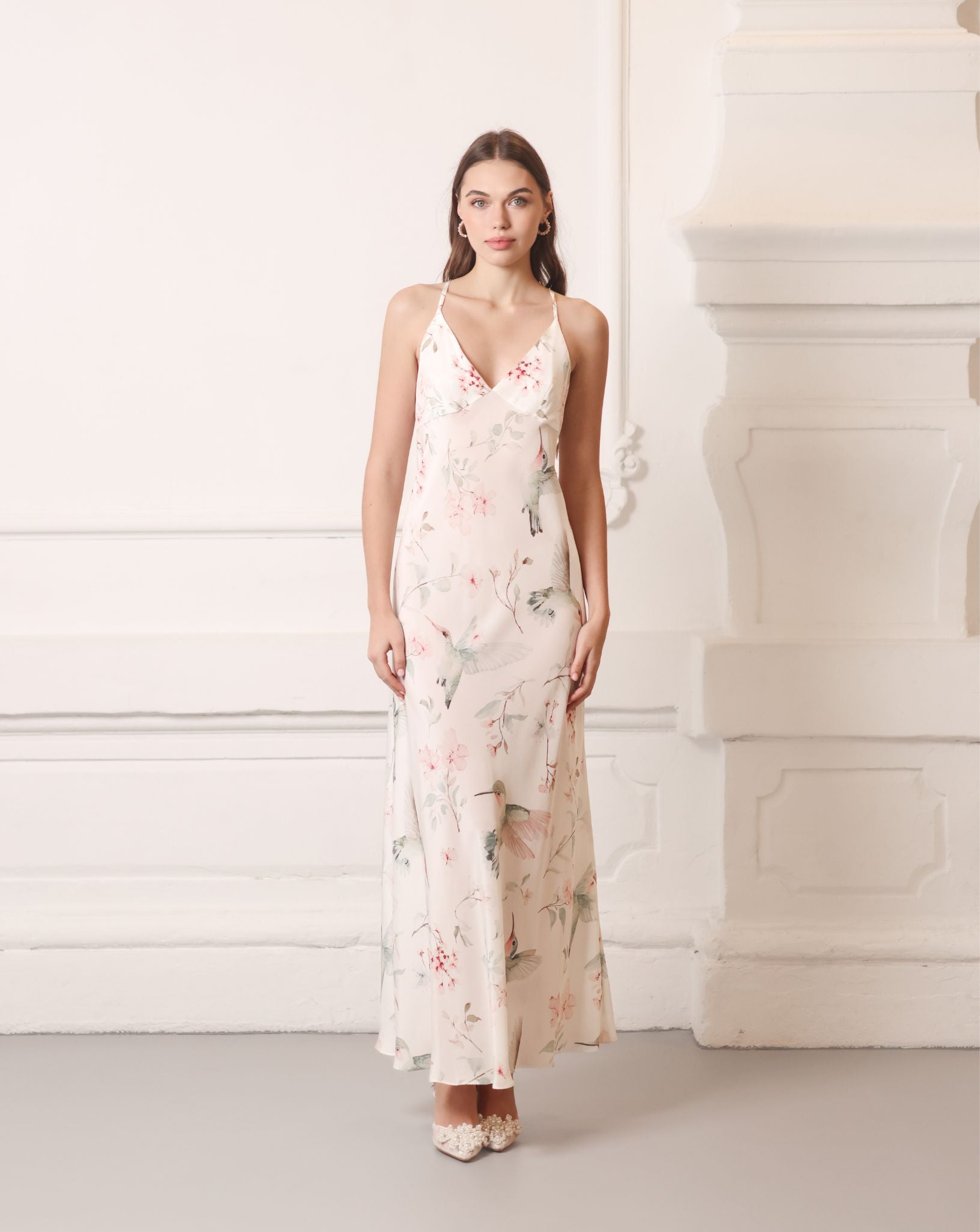 Front view of a structured silk crepe nightgown featuring a delicate floral pattern and a flattering silhouette.