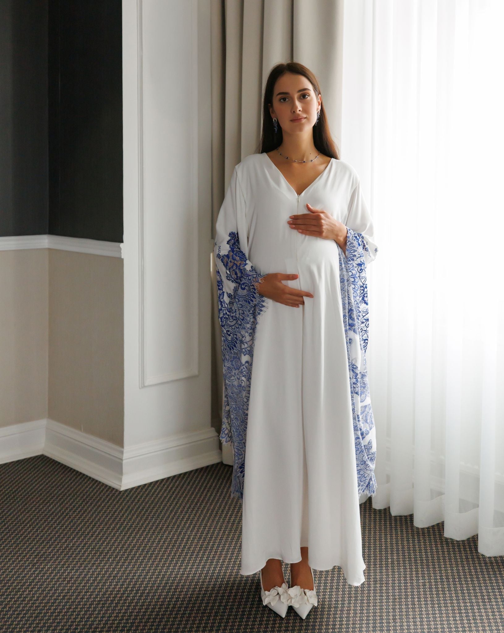 Full-length standing view of the Maternity Kaftan, illustrating its graceful silhouette and weightless feel.