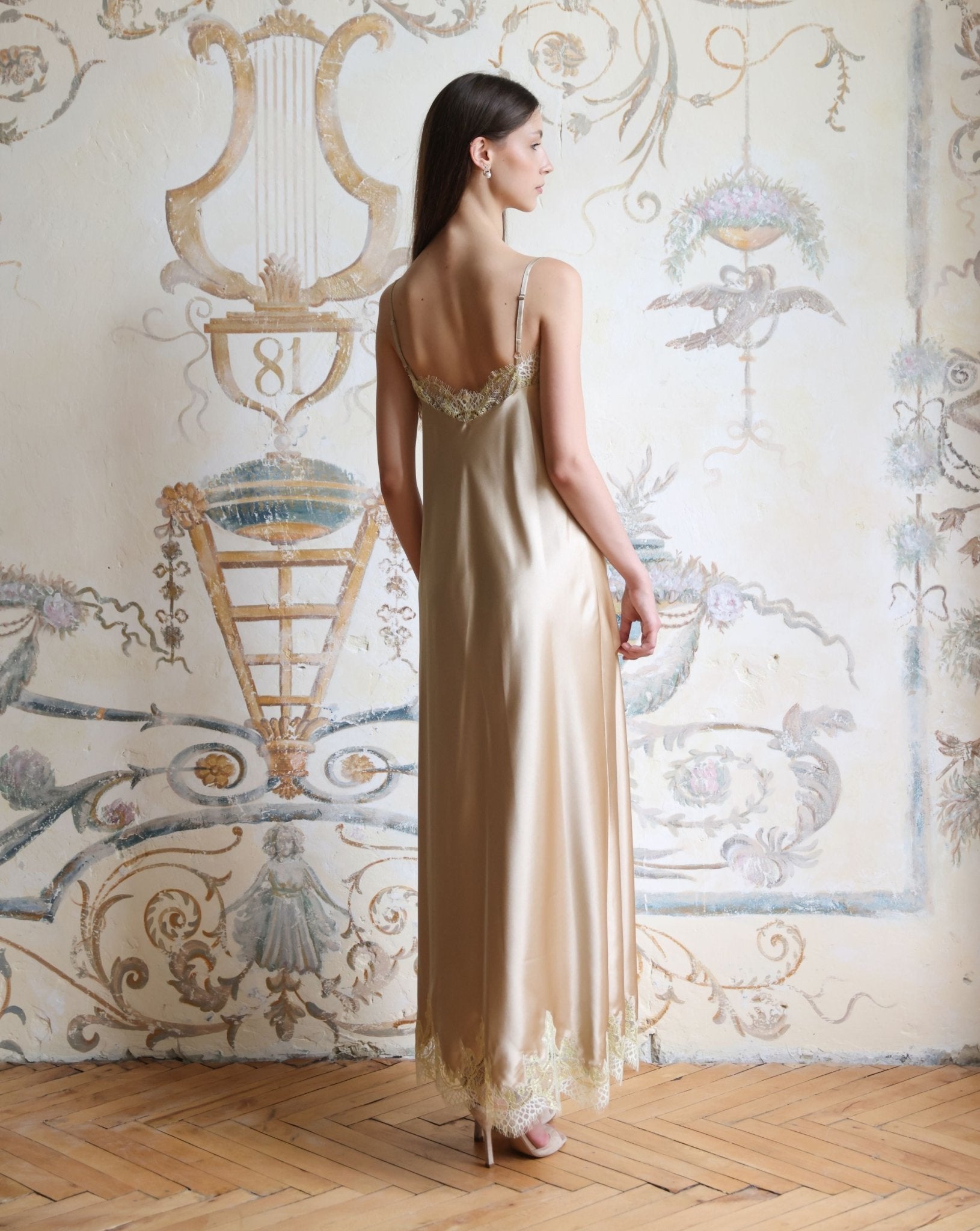 Rear view of the nightgown featuring a mid-open V-cut back and adjustable shoulder straps for a perfect fit.
