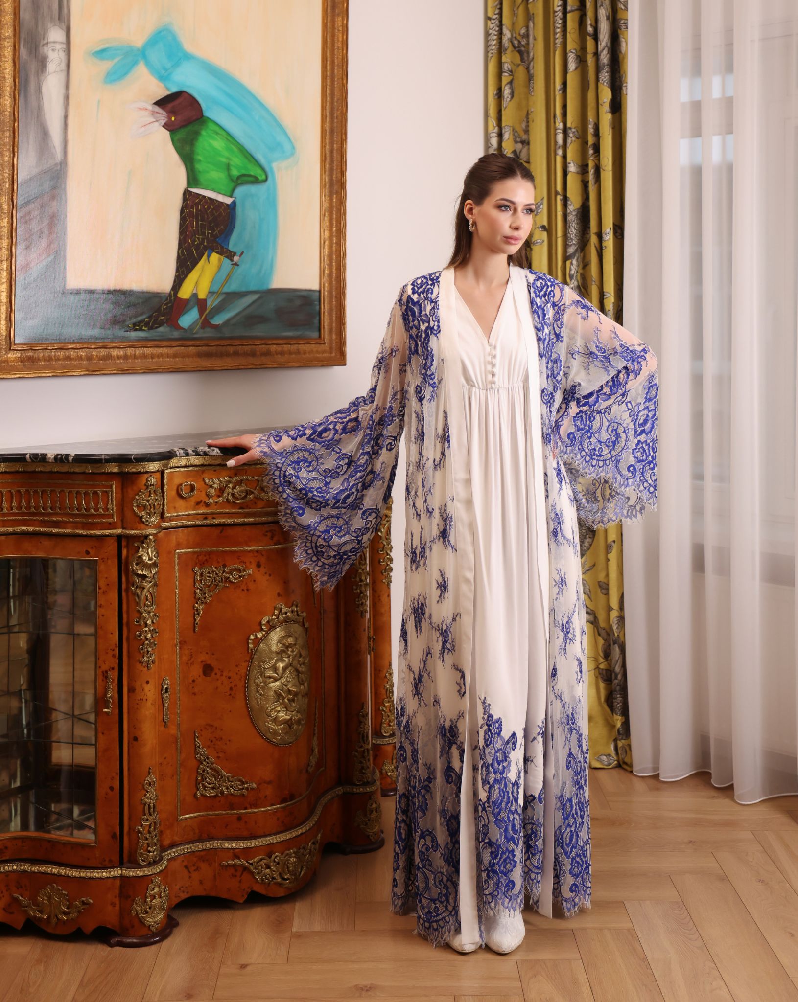 Mid-length view of the tied lace robe over the cotton dress, highlighting the supportive and feminine fit.