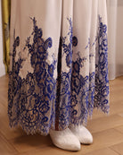 Close-up of the nightgown’s hem, showcasing the delicate French lace trim that adds a refined touch to the design.
