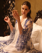 An atmospheric shot of the maternity set, illustrating its effortless elegance during quiet morning rituals.