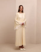 Side perspective of the attire, illustrating a beauty without restriction and a light, weightless silhouette.