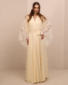 A poised frontal shot of the maternity robe and nightgown set tied with a belt, illustrating a tailored and refined fit.