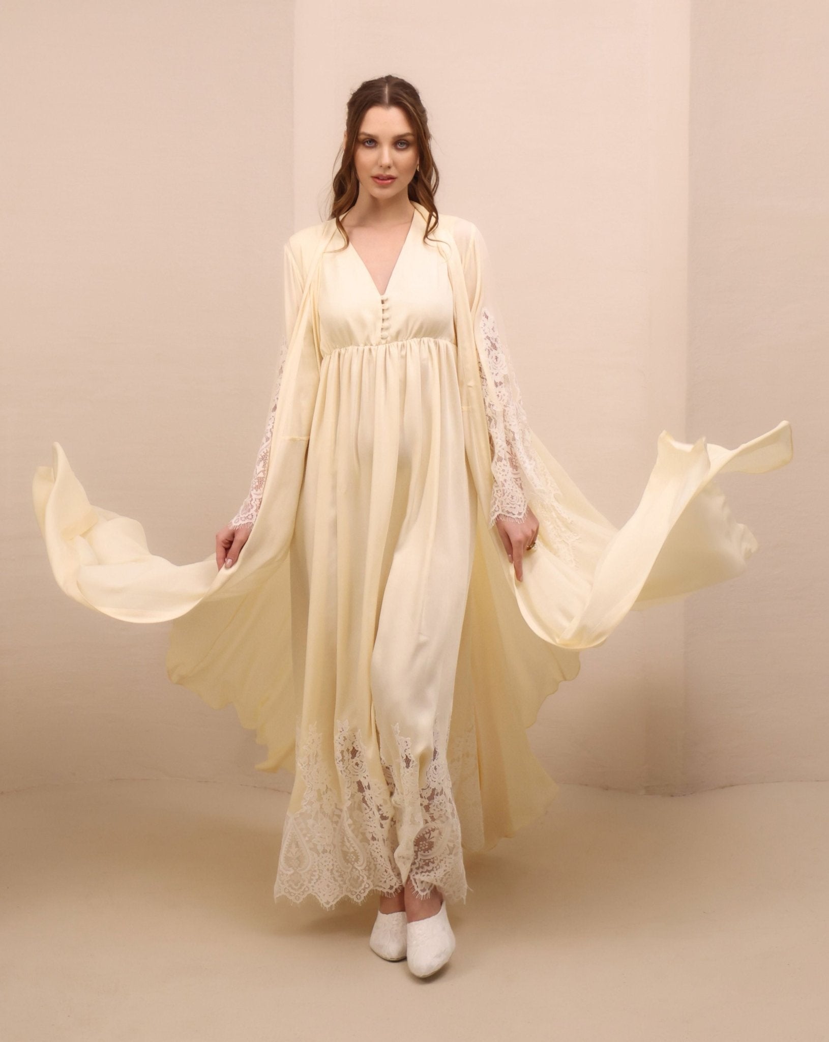 A dynamic view of the maternity robe and nightgown set in motion, capturing the graceful drape of lightweight rayon.