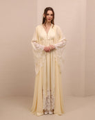 A frontal shot highlighting the wide lace-trimmed sleeves for added elegance and a timeless, graceful silhouette.