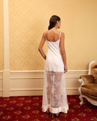 Rear view of the satin nightgown, focusing on the sleek fit and how it follows the natural curves of the silhouette.