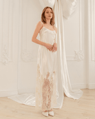 A side perspective of the nightgown, showcasing the smooth fit and the adjustable shoulder straps that tie at the top.