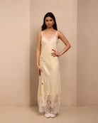 Frontal view of the nightgown with thin straps and lace around the neck, illustrating a soft and natural fit.