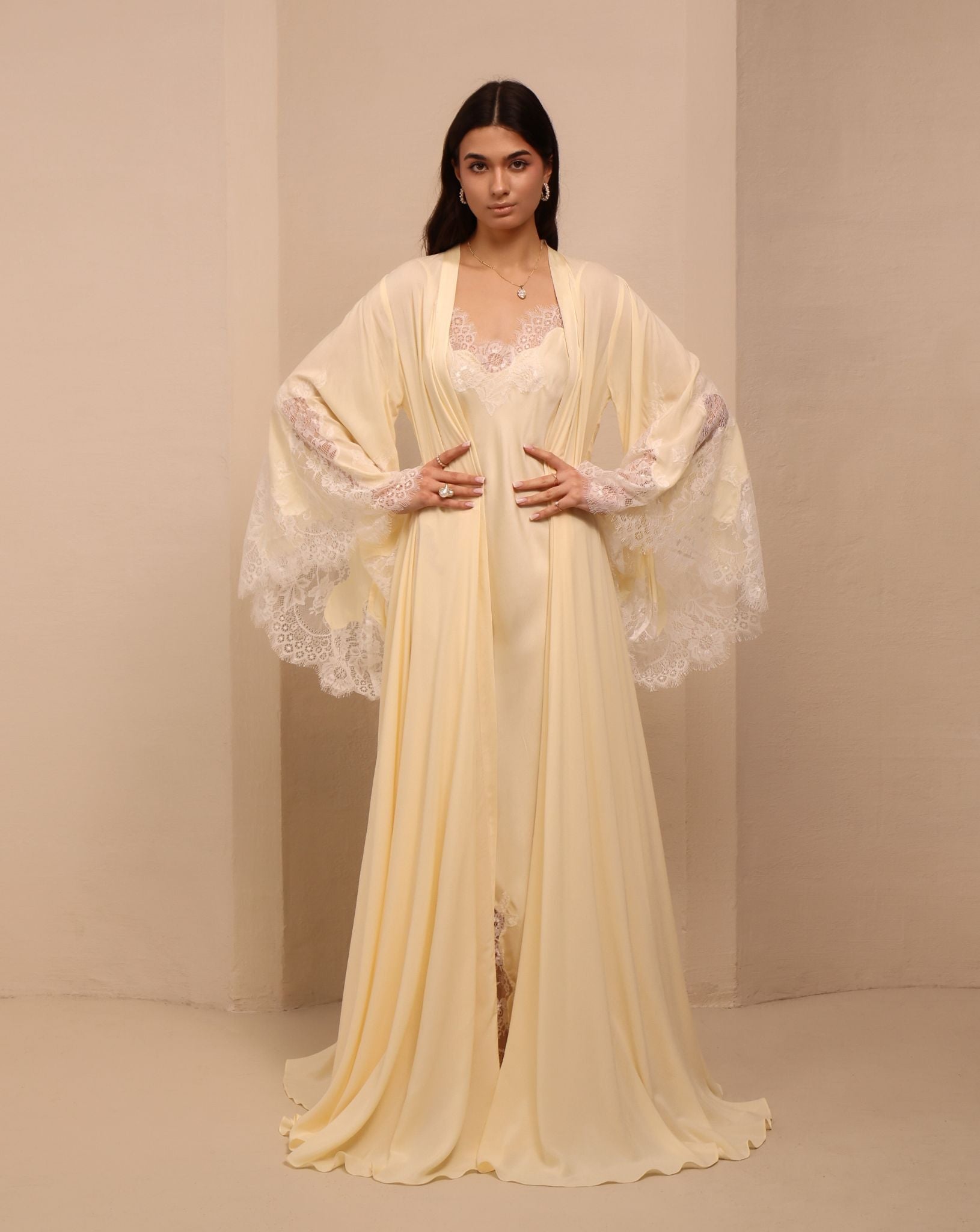 A frontal shot of the tied robe, showcasing wide sleeves adorned with pretty lace and a flattering waistline.