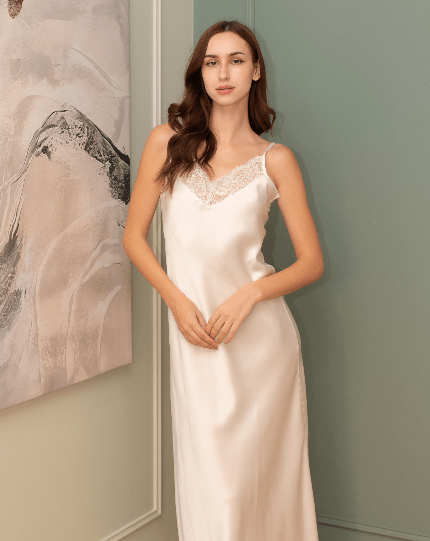 Mid-length view of the pure silk nightdress, focusing on the wider fit and the cool, calming surface of the fabric.