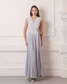 A motion view of the woman walking in the loose-fitting nightgown, capturing the freedom of movement.