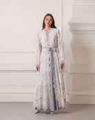 A poised static view of the full wrapped ensemble, illustrating the elegant coverage and soft lines.