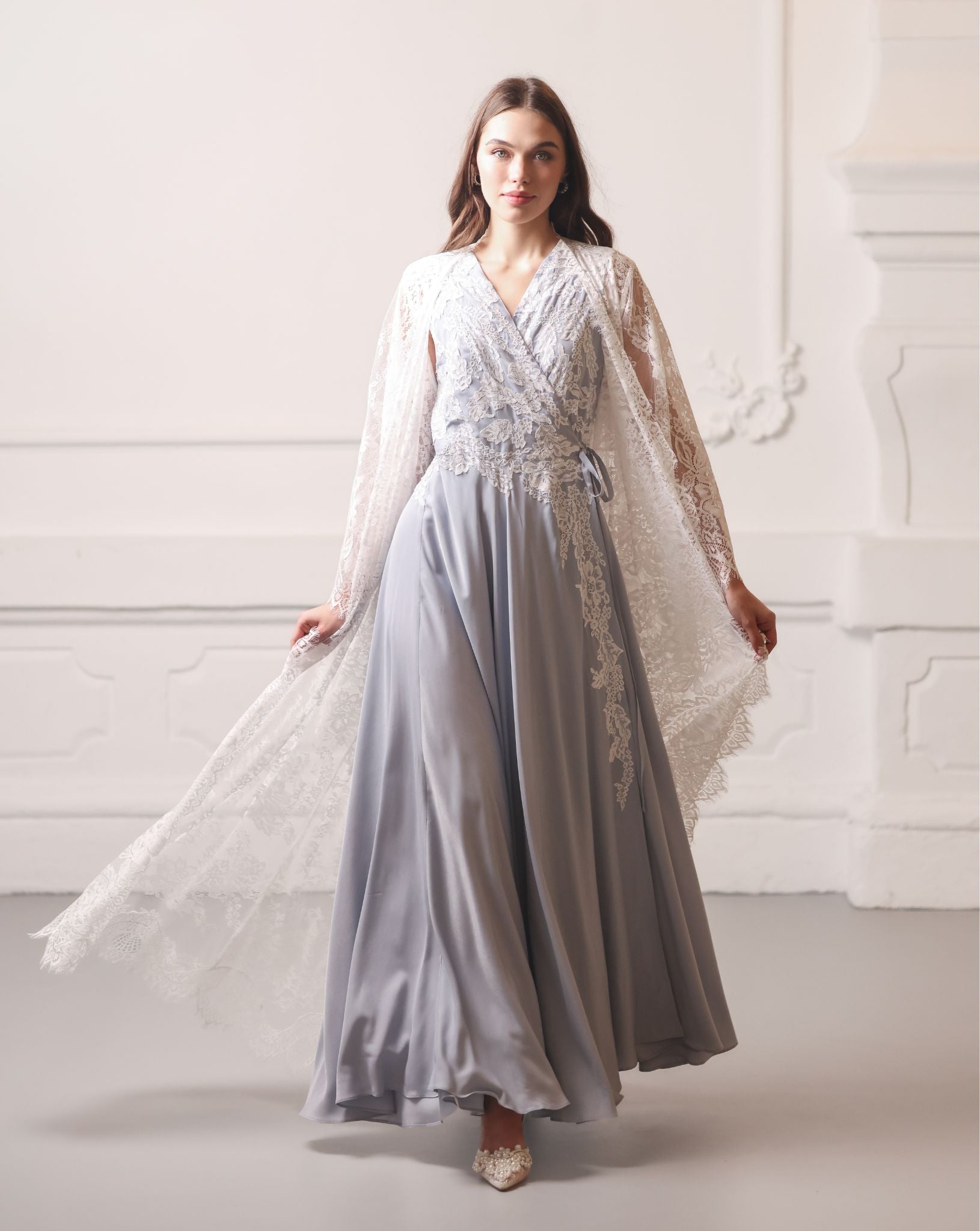 A dynamic motion shot capturing the ensemble as it flows gracefully while the woman walks.