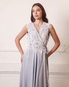 A focused shot of the nightgown with hands on hips, drawing attention to the intricate lace embellishments.