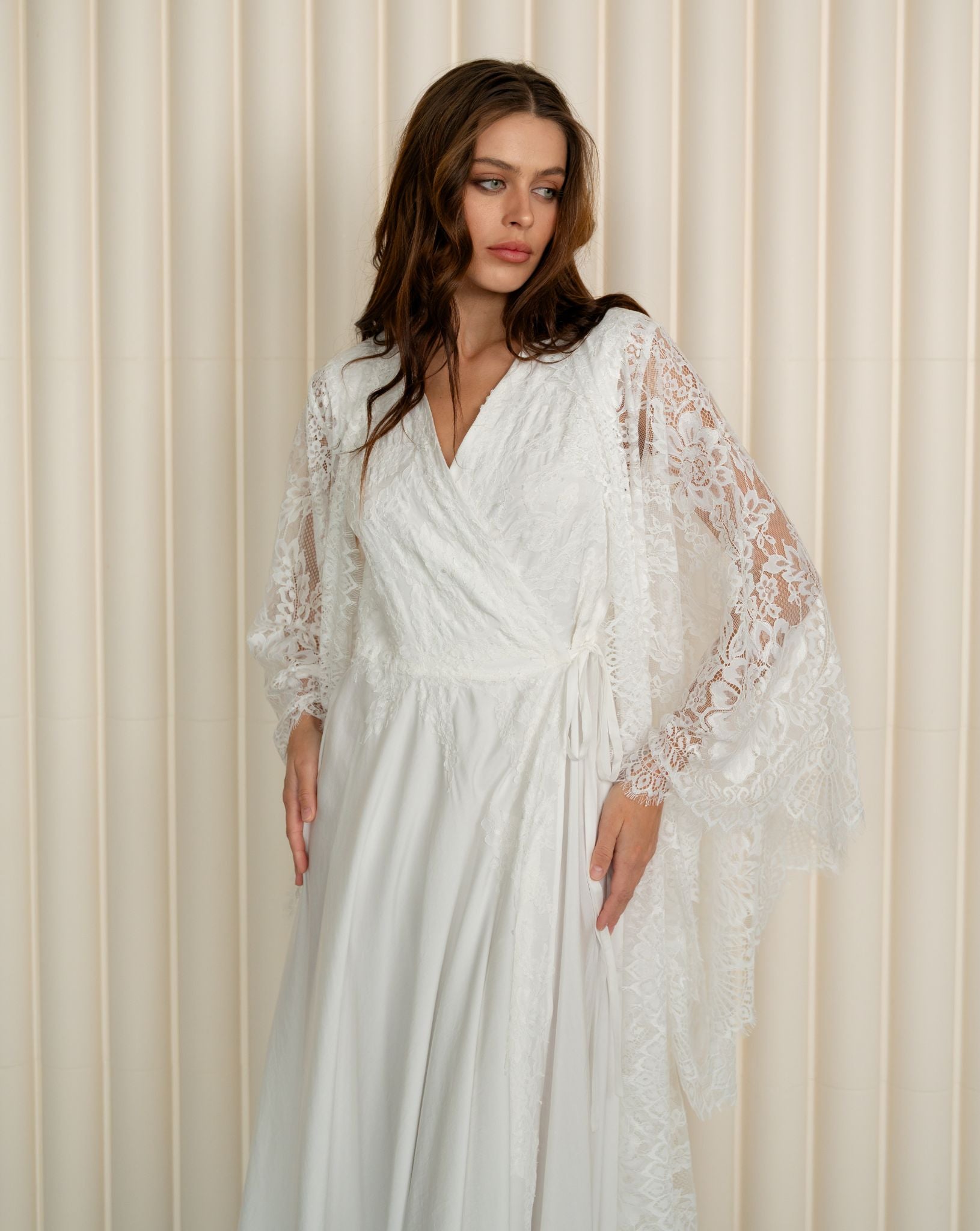 A mid-length shot from head to knees, focusing on the beautiful lines and the graceful flow of the sleeves.