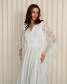 A mid-length shot from head to knees, focusing on the beautiful lines and the graceful flow of the sleeves.