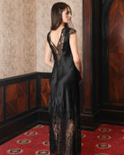 Rear view of the silk nightdress, showing the elegant drape and the striking lace detailing on the back.