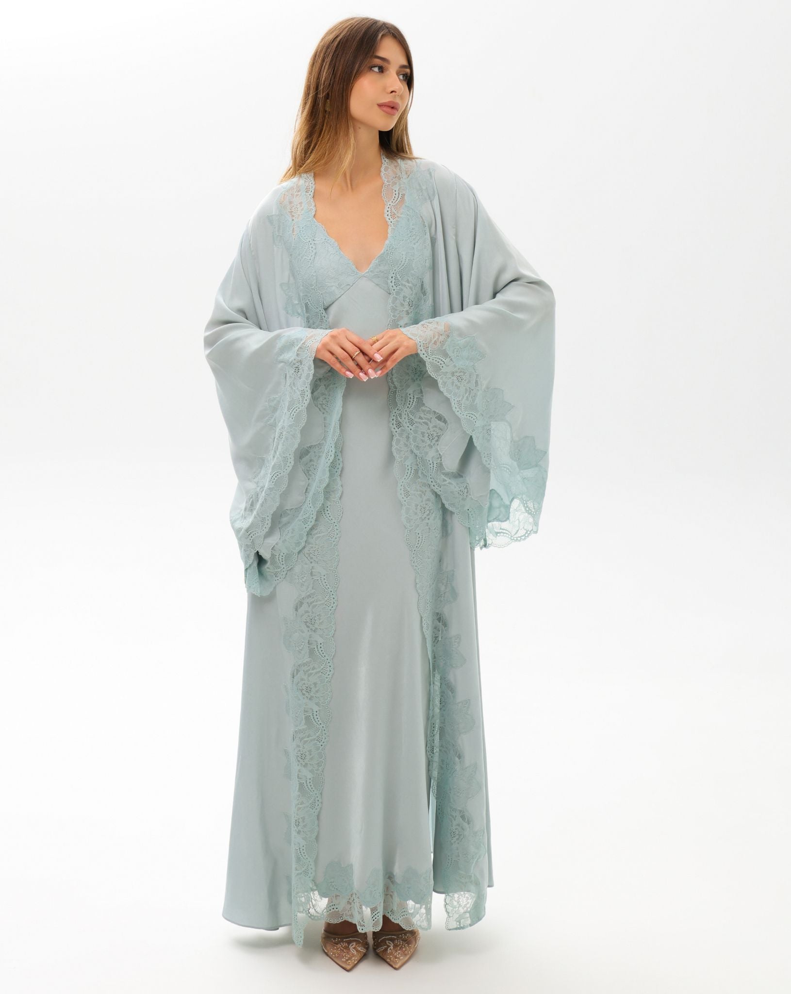 A frontal shot featuring floral lace embellishment on the sleeves, showcasing the essence of soft femininity.