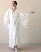 Frontal view with one arm extended to highlight the lace detailing and the reliable, high-quality material.