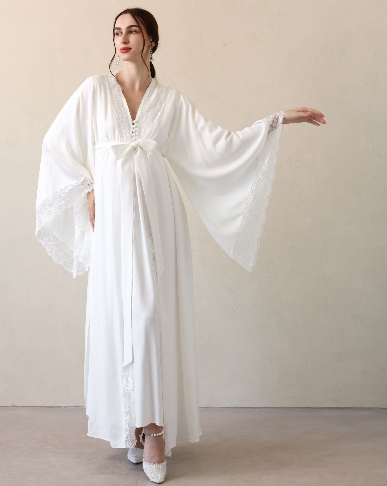 Frontal view with one arm extended to highlight the lace detailing and the reliable, high-quality material.