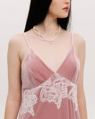 Close-up from neck to waist, highlighting the flattering V-neck and the soft, plush texture of the velvet.